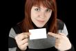 Girl pointing at a blank business card