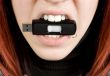 Girl biting an usb flash drive