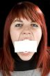 Girl biting a blank greeting card