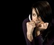 Seductive girl checking out someone and biting nails