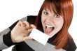 Cute redhead holding blank business card