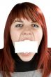 Girl biting a blank greeting card