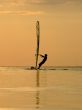 Silhouette of a wind-surfer on a sunset 1