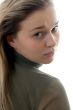 Portrait of the young beautiful girl on a white background. Stud