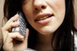 young woman is speaking on cell phone