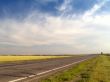 Asphalt road with drammatic sky