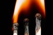Match with smoke isolated in dark background