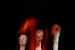Match with smoke isolated in dark background