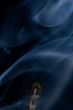 Match with smoke isolated in dark background