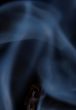 Match with smoke isolated in dark background
