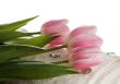 Pink tulips on white towel. SPA composition