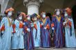 Group of the Venetian masks in blue suits.