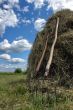 stack of hay and pair of pitchfork