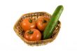 Basket with tomatoes and cucumber