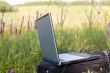 Laptop with case on meadow