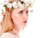 Pretty spring girl with wreath on head looking forward