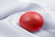 Red egg on white
