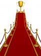 Gold cup of the winner on a red carpet path.