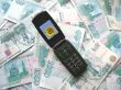Mobile phone laying on banknotes of Russia