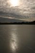 Patches of light of the sun on an ice and the sky.