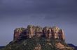 Storm over sunlit rocks