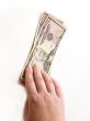 Hand with dollars