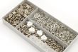 Metal button in box