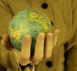 Globe in a girl`s hands