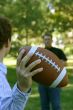 Two men throwing the football
