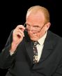 Businessman Looking Over Glasses