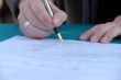 Businessman is signing a contract