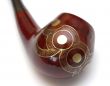 Close-up of curved ornamented north-caucasian pipe
