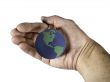Blue and Green globe cradled in hand