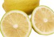 Closeup of three lemons on white
