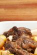 Lamb shanks cooked with potatoes