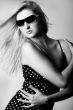 Girl with sunglasses looking down