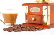 Cup, grinder, coffee pot and beans