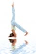 supported headstand on white sand 3