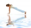four-limbed staff pose on white sand