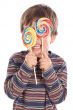 Child eating two lollipops