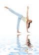 half moon pose on white sand