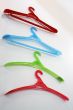 Colored coat hangers.