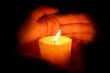 hands keeps candle