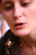 Girl looking at spider web