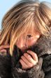 girl in a fur coat in the winter  	