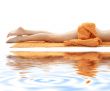 long legs with orange towel on white sand 3