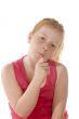 A young child enjoys a lollypop