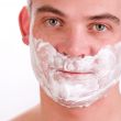 Shaving young man
