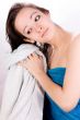 Woman is drying her hair