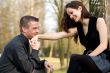 Young man kissing her hand